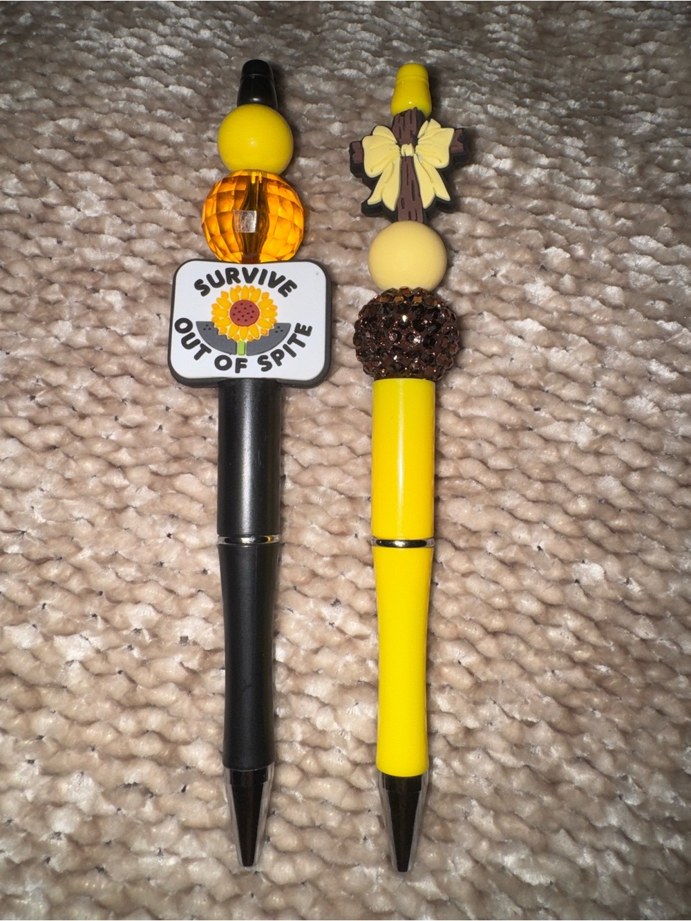 Two Pens Survive Out of Spite pen and a bow pen NWOT